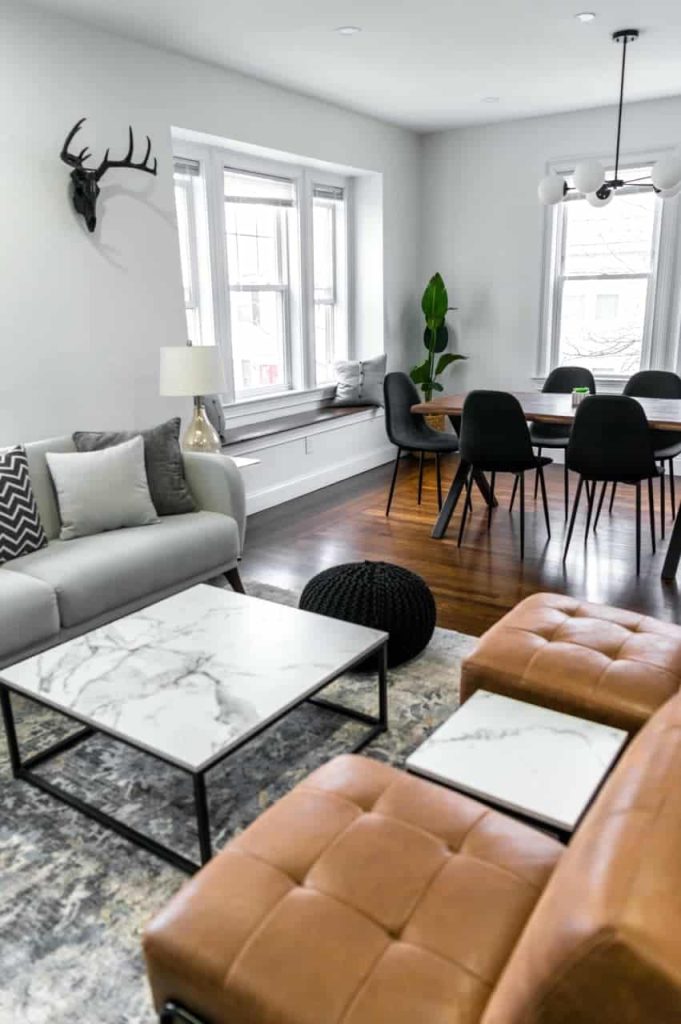 A living room with a sustainable leather couch and coffee table, advanced property