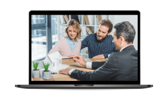 A couple discusses housing plans with a property management expert in Hamilton. They sit at a table, examining a small model house displayed on a laptop screen.
