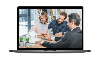 A couple discusses housing plans with a property management expert in Hamilton. They sit at a table, examining a small model house displayed on a laptop screen.