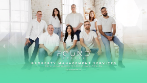 A group of eight people posing indoors in casual attire. The text reads: "Found Spaces - Property Management Services. Premium apartments across Hamilton, ON, and the best property management in Guelph."