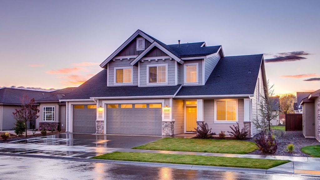 A futuristic house with a garage at dusk, reflecting the potential future of property management, property management hamilton on