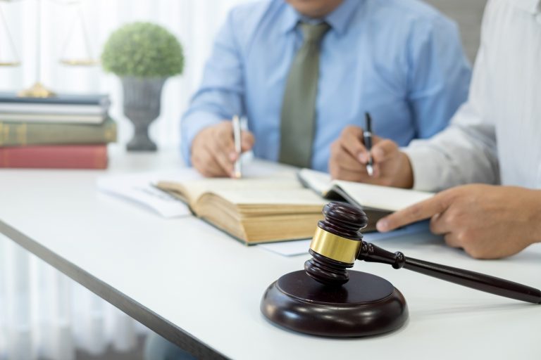 lawyers team discuss legal matters to assist client