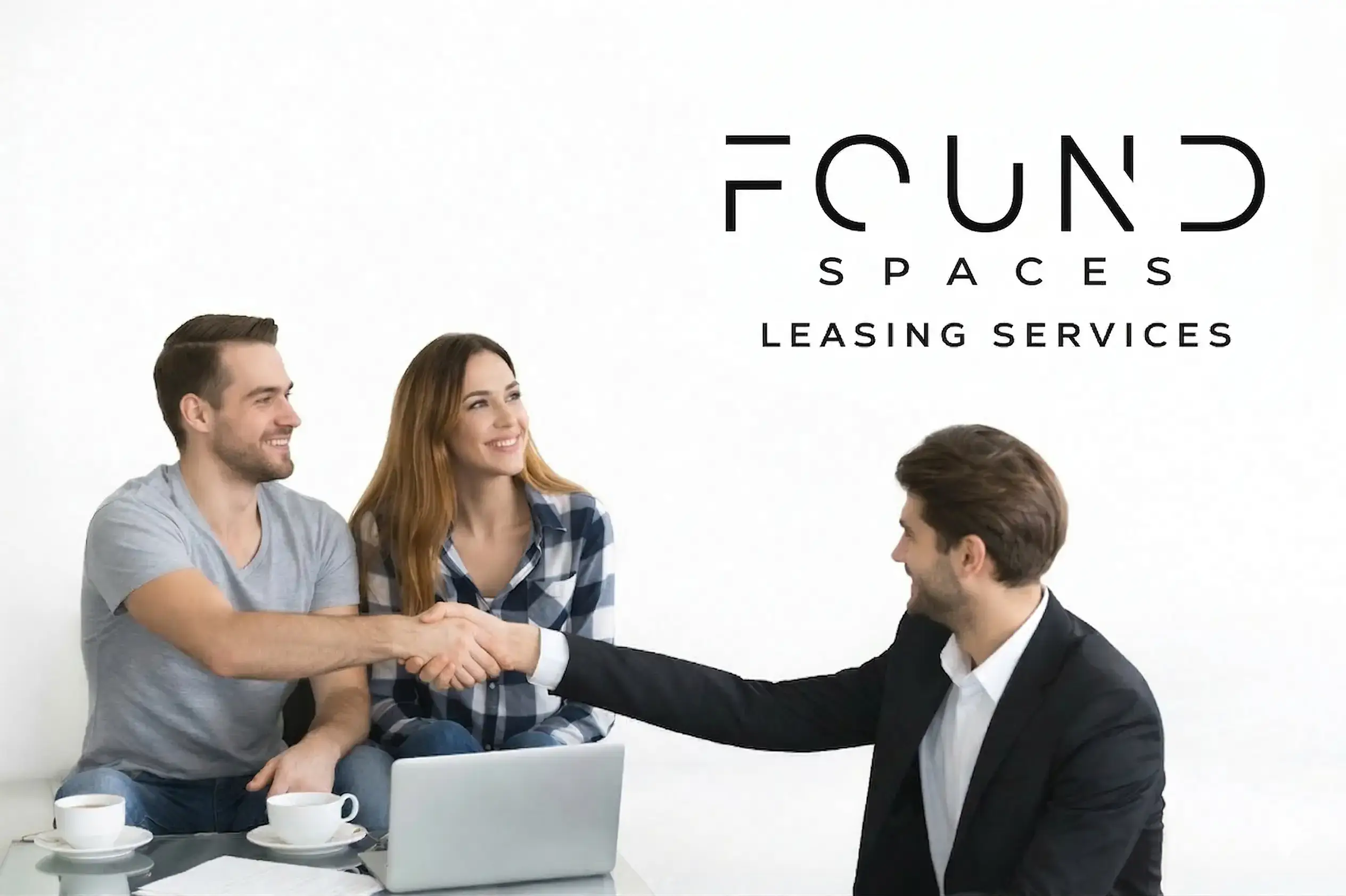 A man and woman sit with a laptop and coffee while shaking hands with a man in a suit; text reads "Found Spaces Leasing Services.